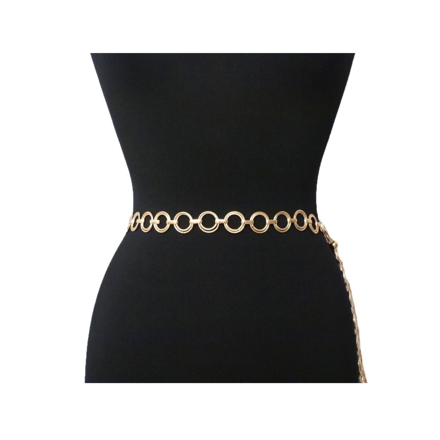 Gold chain belt on a black mannequin with a white background
