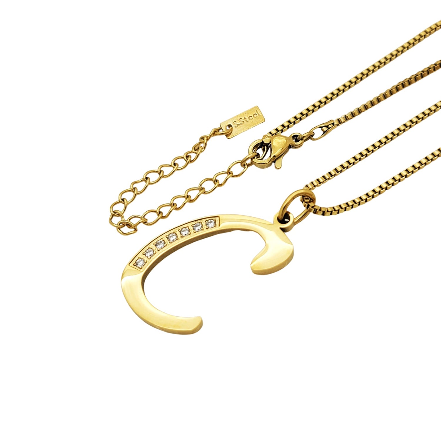 Gold necklace with a C pendant on a white background