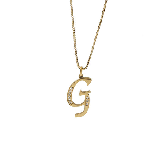 Gold necklace with a 'G' pendant on a white background