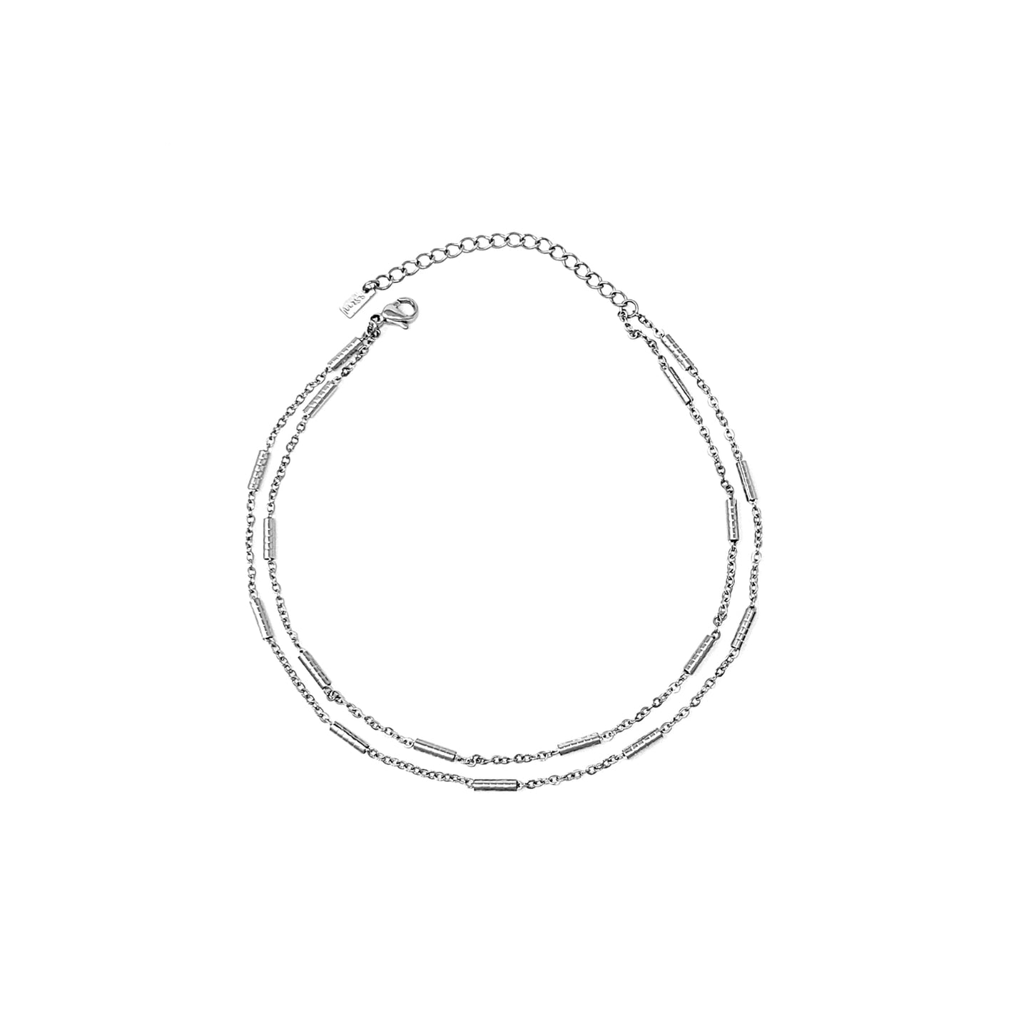 Silver anklet on a white background