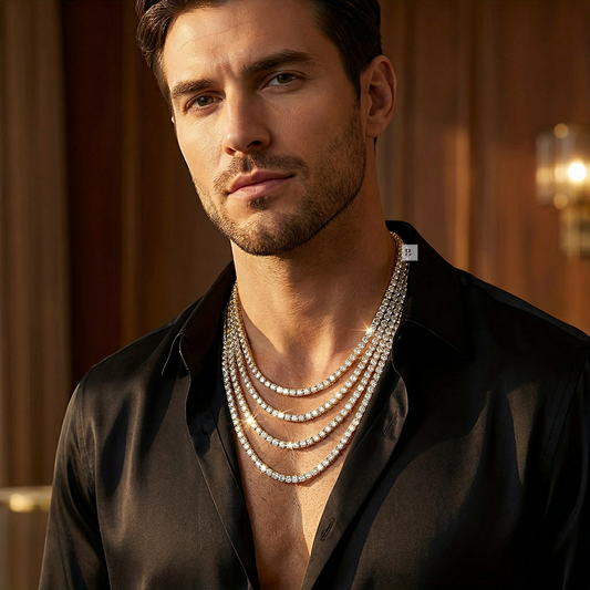 Man wearing multiple Tennis necklaces in a warm-toned indoor setting