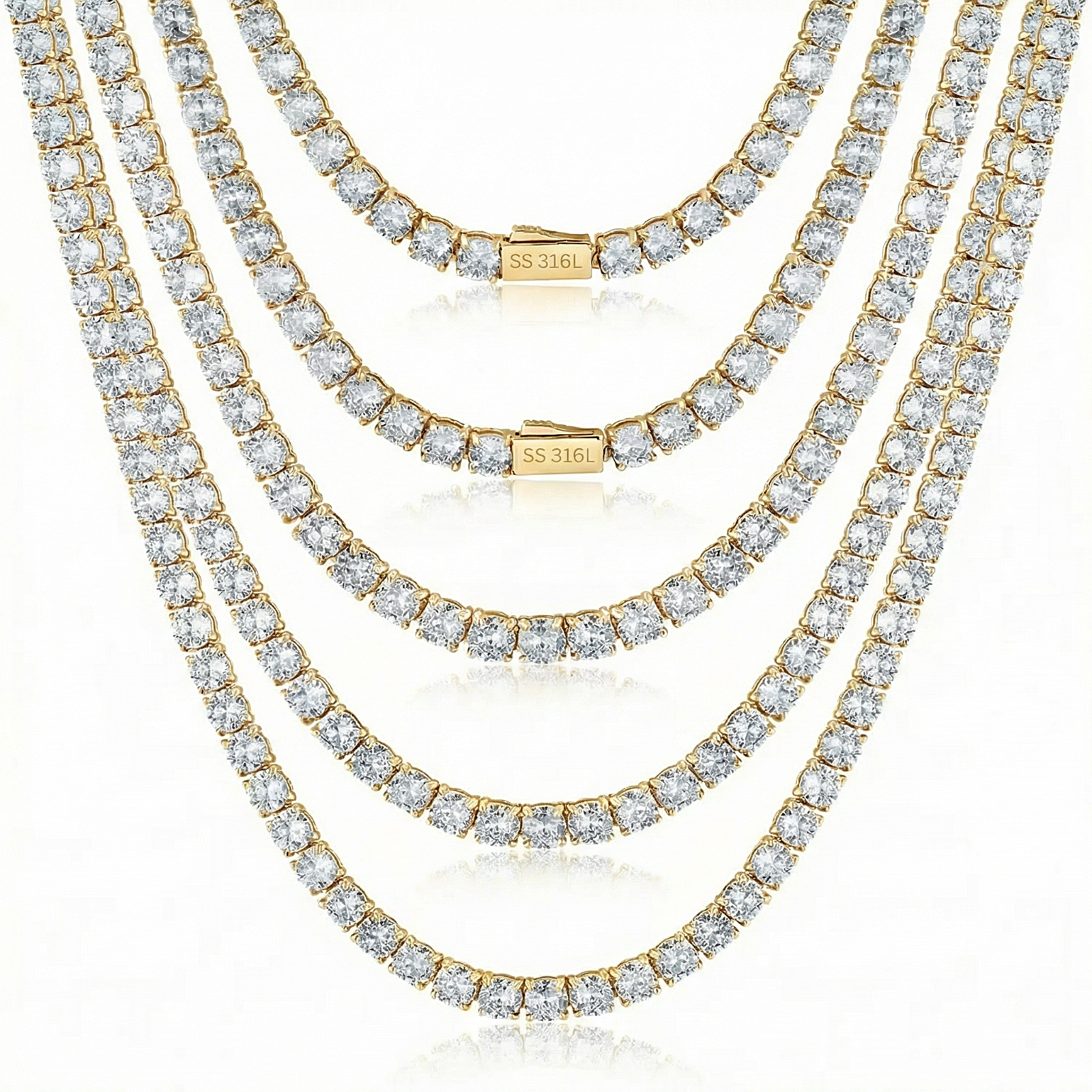 Three diamond necklaces stacked on a white background