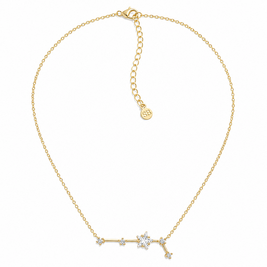 A delicate gold chain necklace featuring a horizontal star constellation pendant with clear rhinestones, displayed on a clean white background.