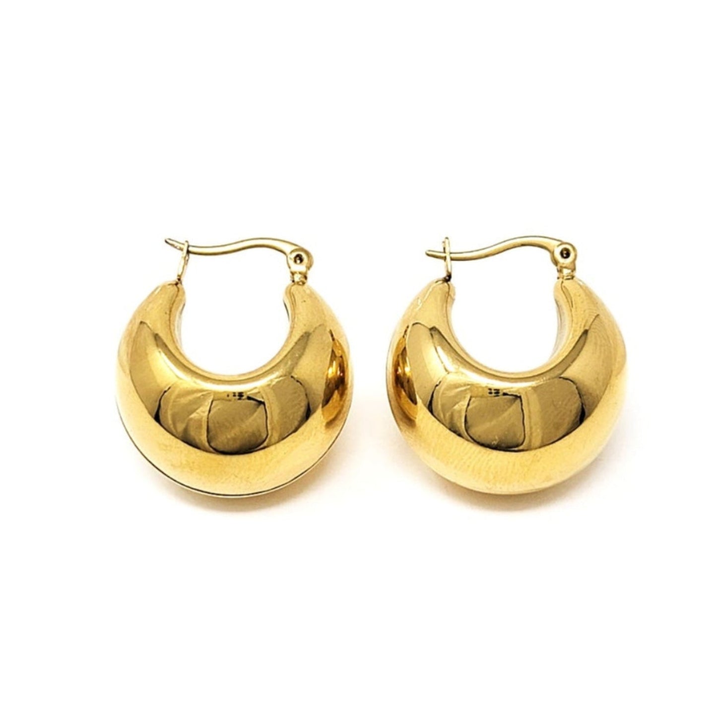 Gold hoop earrings on a white background