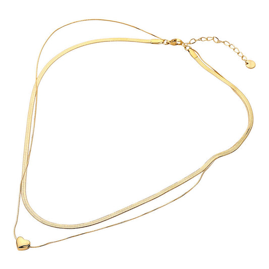 Gold necklace with a heart pendant on a white background
