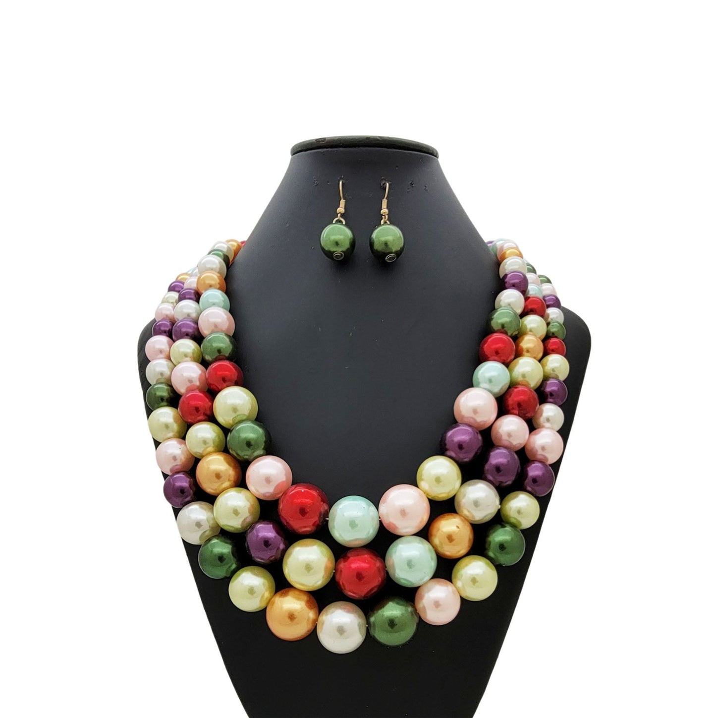 Colorful pearl necklace and earrings set on a black mannequin bust.