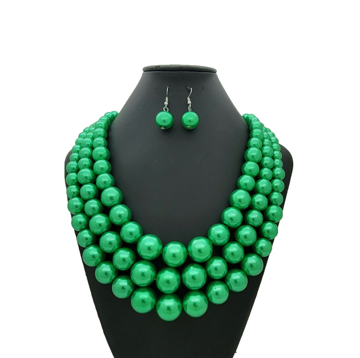 Green beaded necklace and earrings on a black mannequin bust against a white background