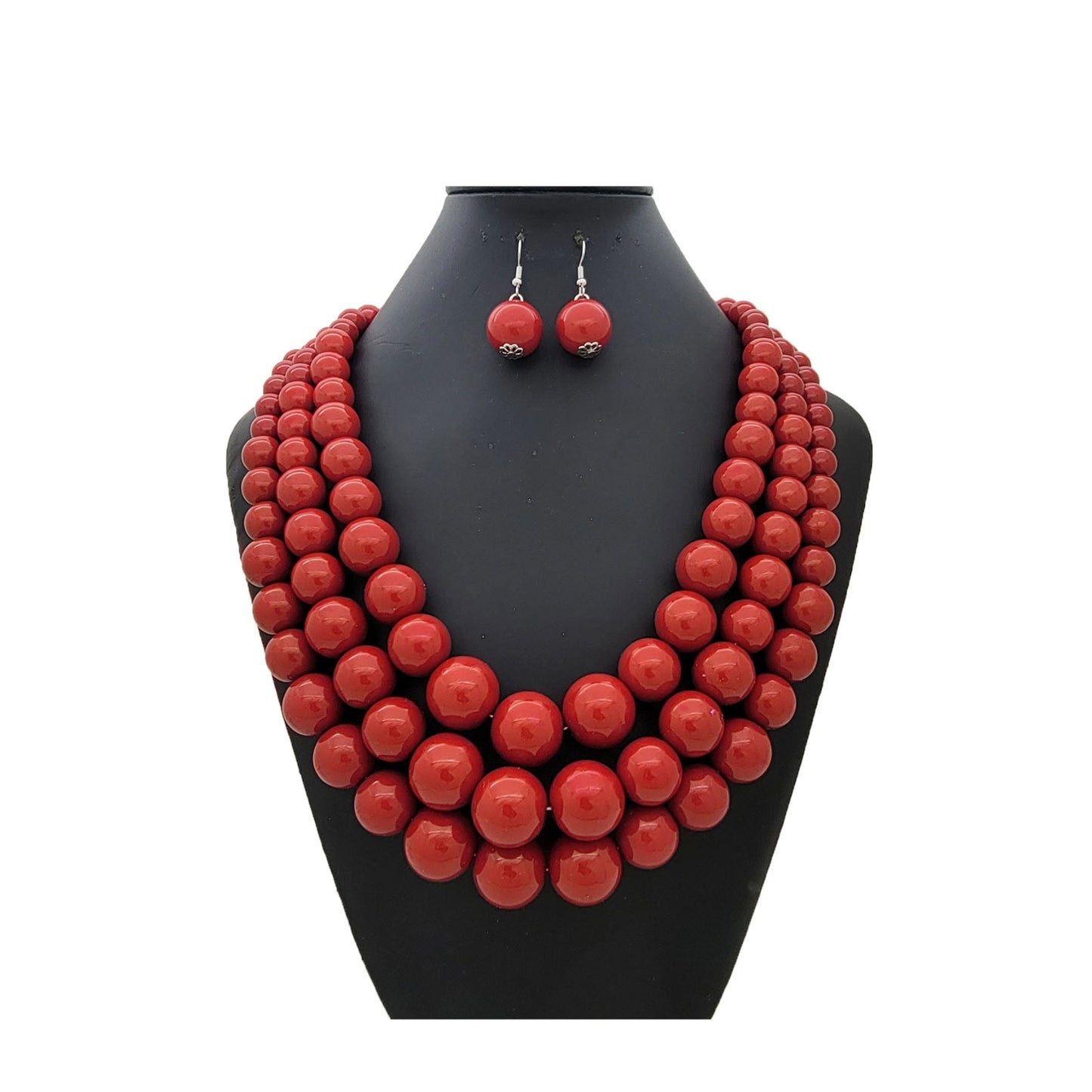 Red beaded necklace and earrings set on a black mannequin bust against a white background