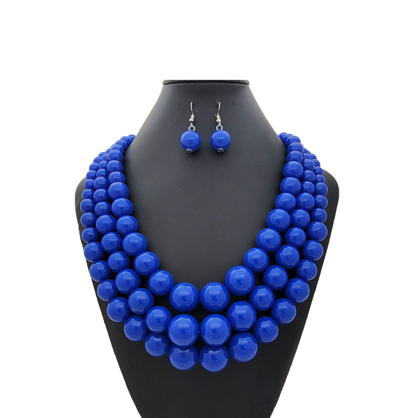 Blue beaded necklace and earrings on a black mannequin bust against a white background