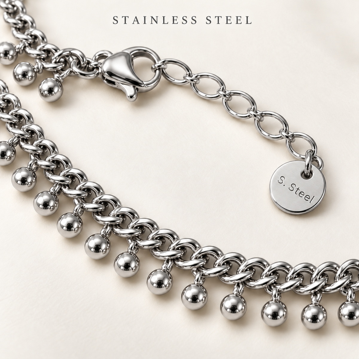 Stainless steel ball charm anklet detail close up