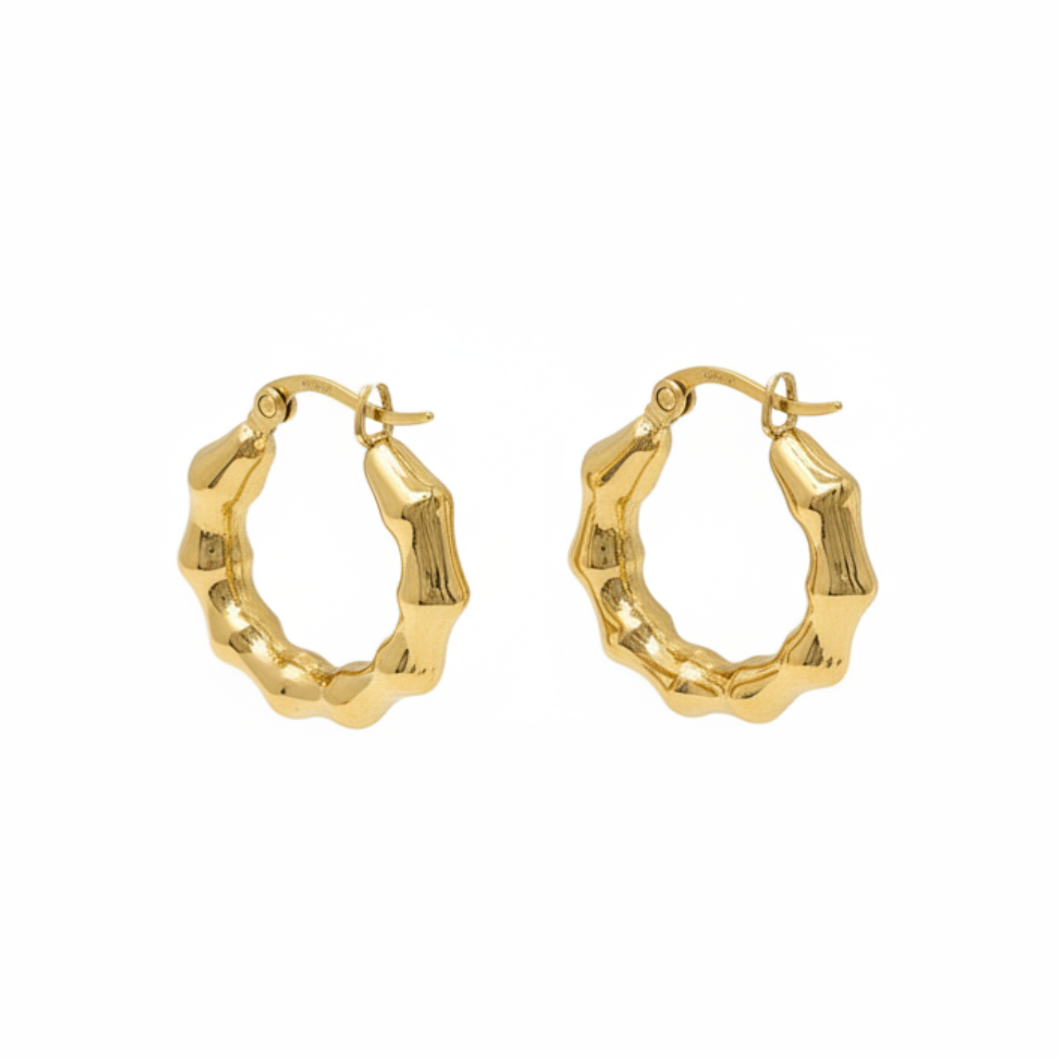 Gold hoop earrings on a white background