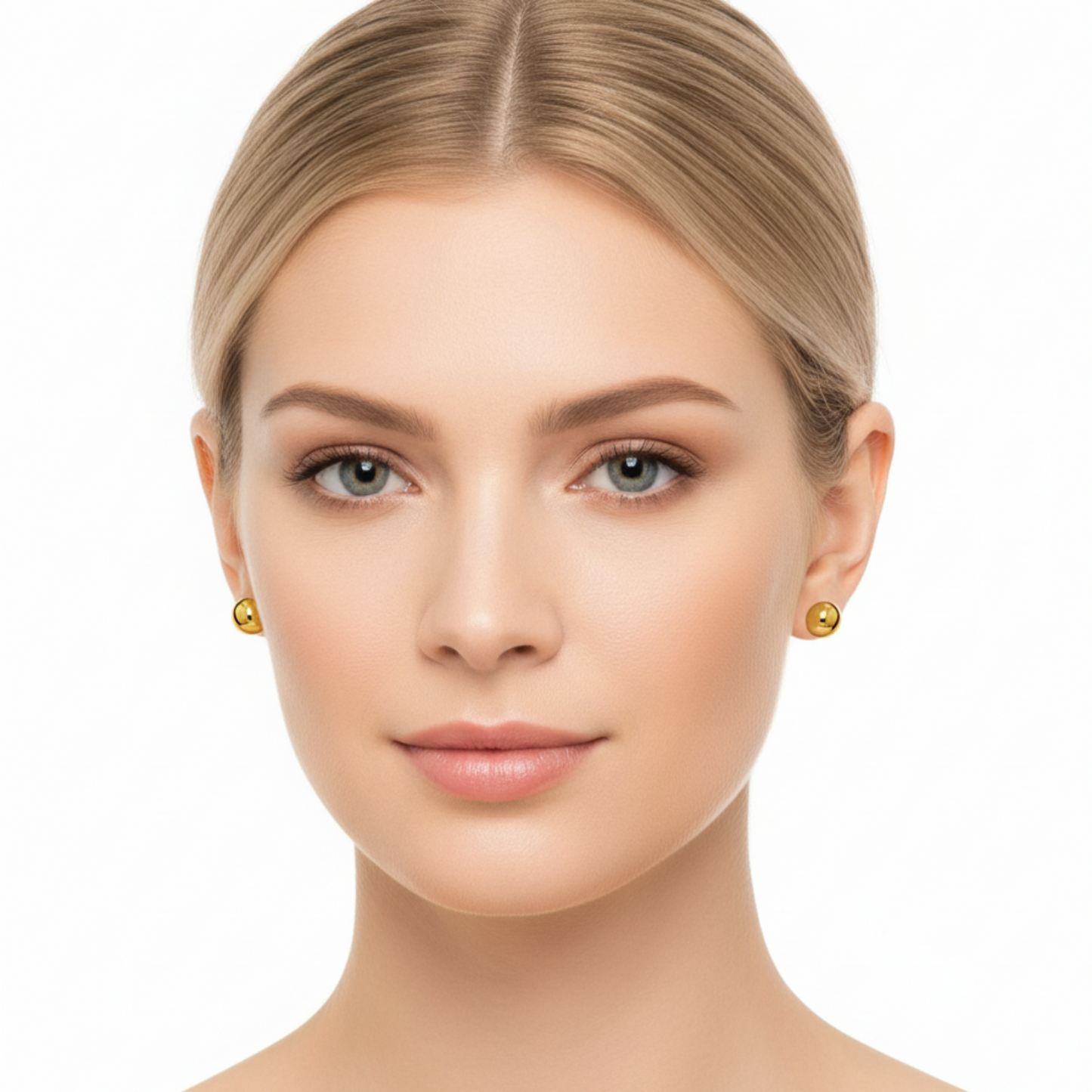 Woman wearing gold earrings on a white background