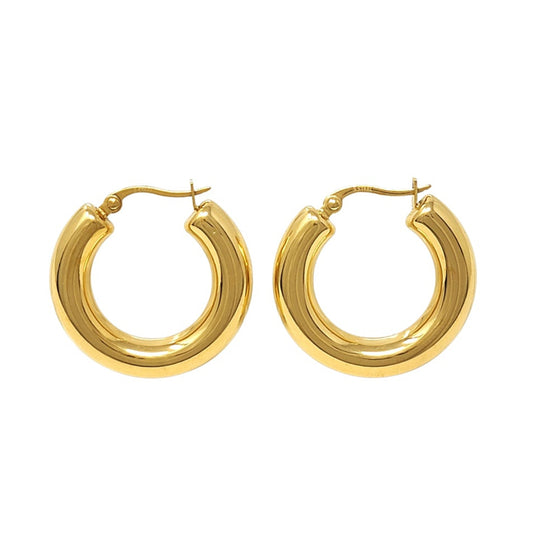 Gold hoop earrings on a white background