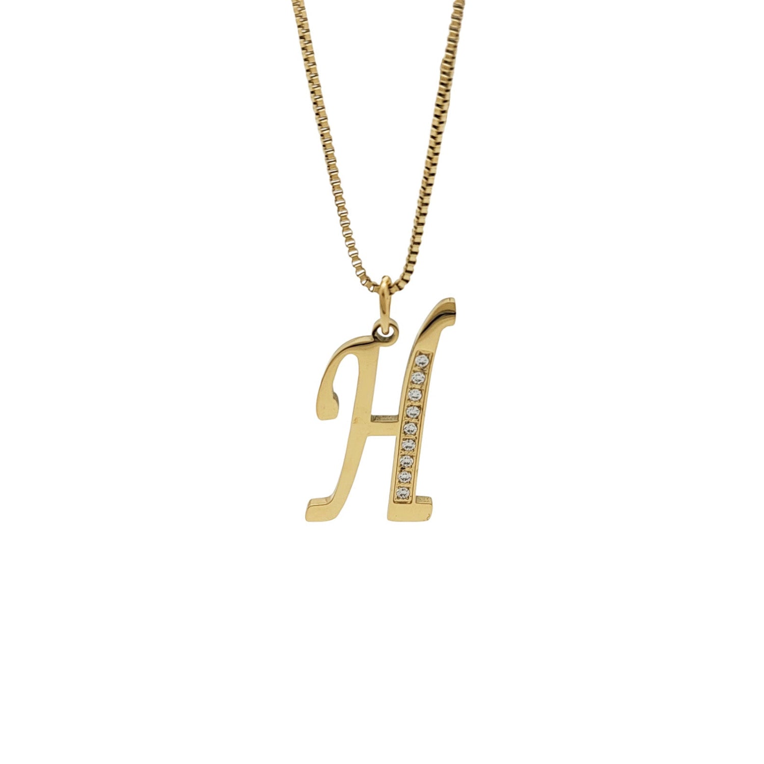 Gold necklace with 'H' pendant on a white background