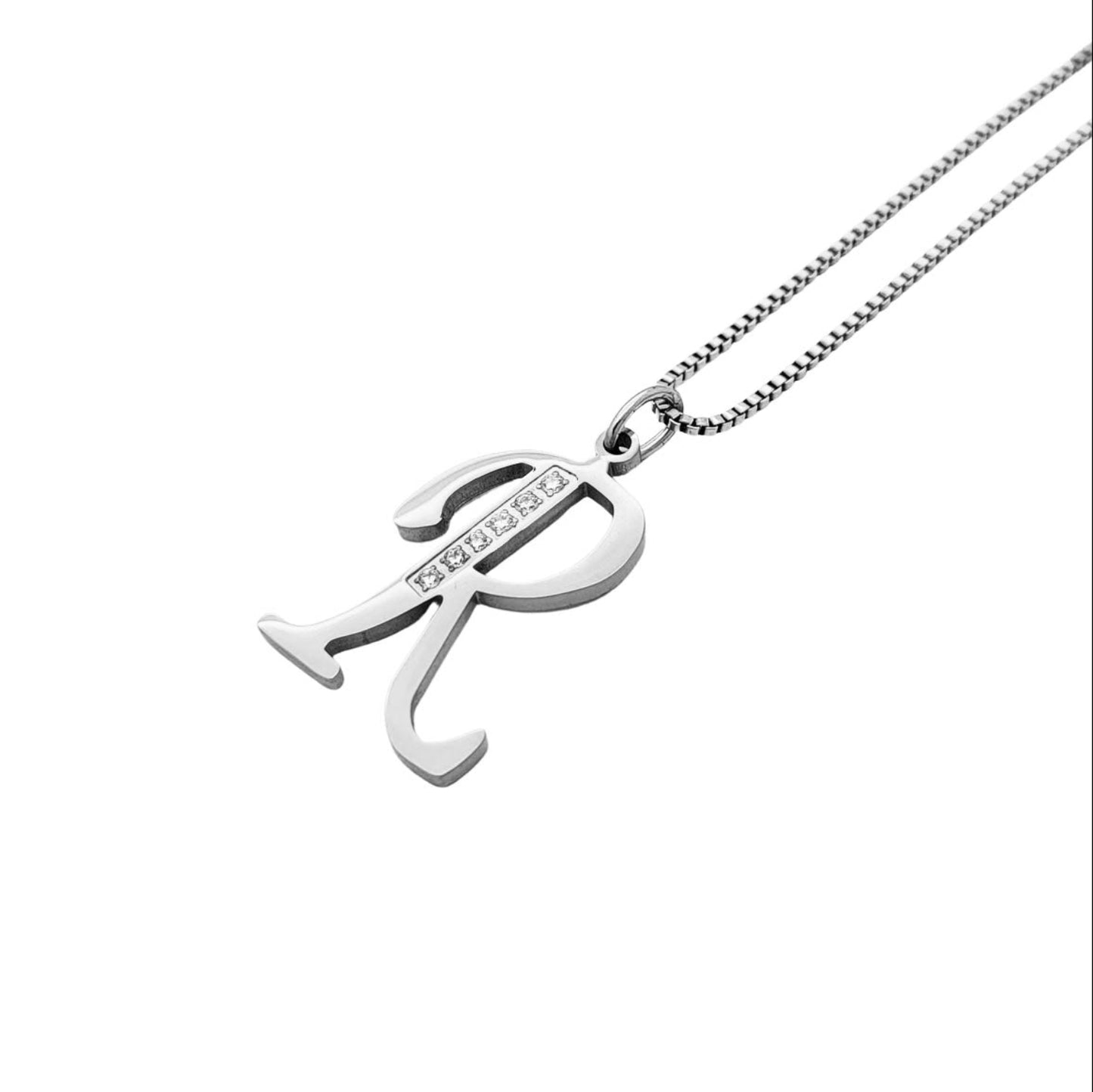 Silver R pendant necklace on a white background