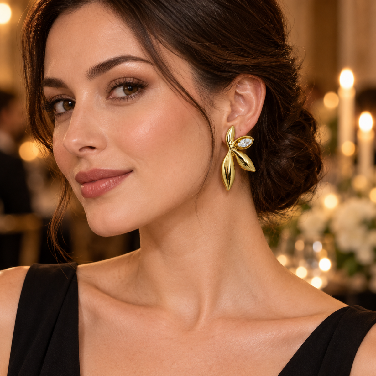 Beautiful women wearing stainless steel leaf shape earring with black dress
