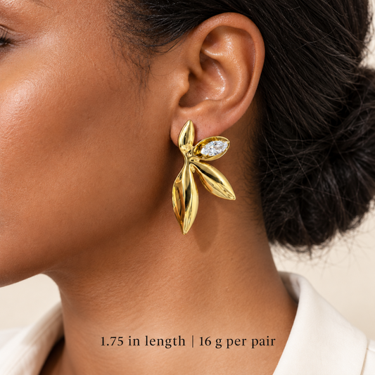 Women wearing stainless steel leaf statement earring