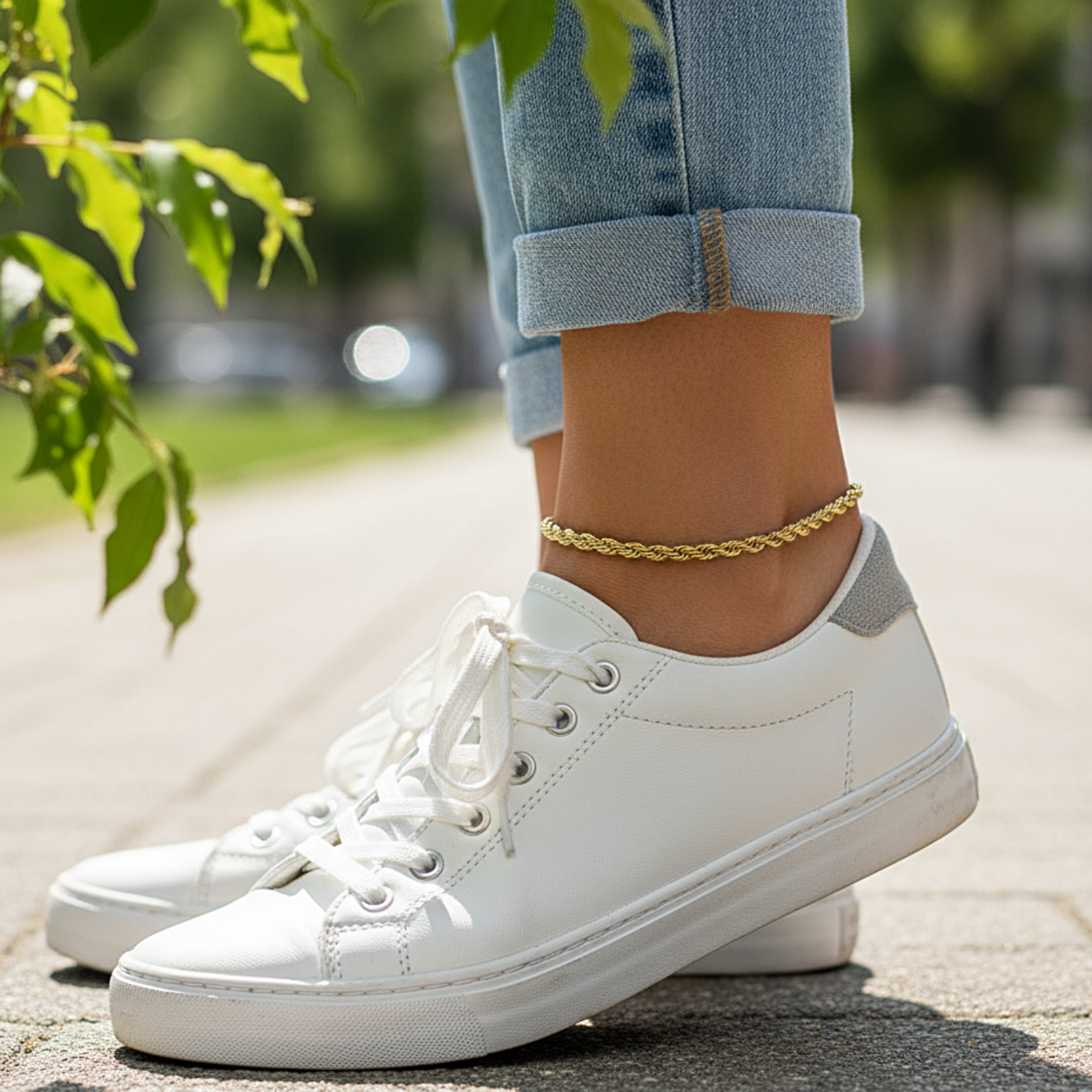 White sneakers worn on a person's feet with a blurred outdoor background