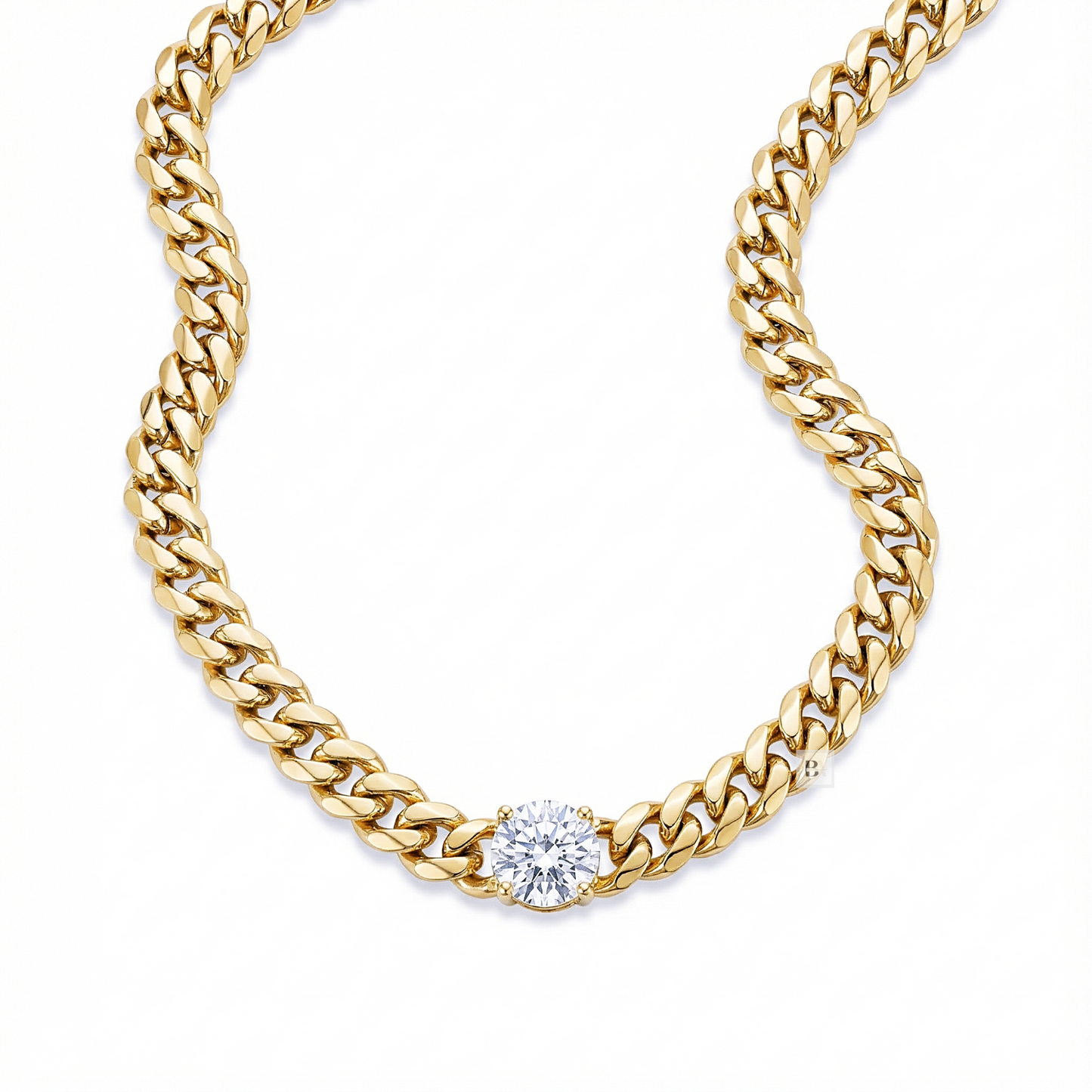 Gold chain necklace with a diamond on a white background