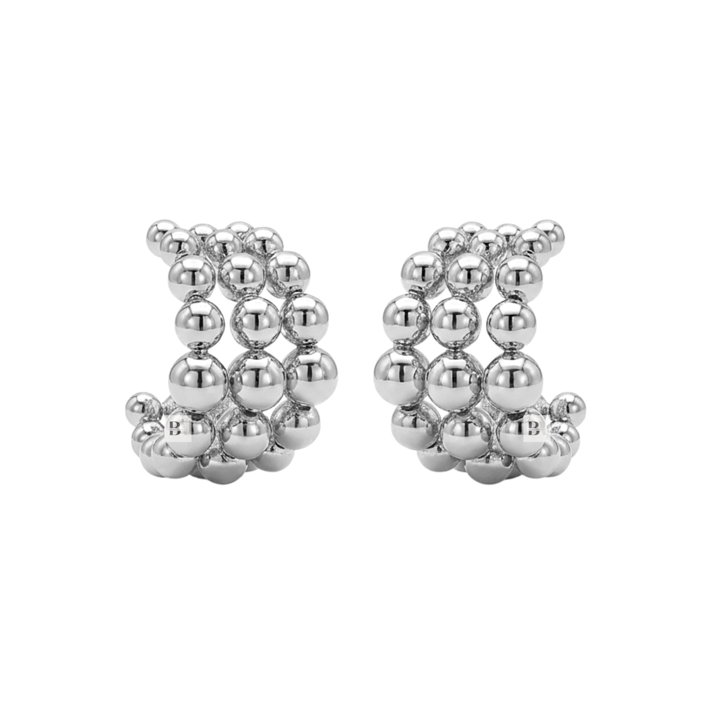 Pair of silver beaded earrings on a white background
