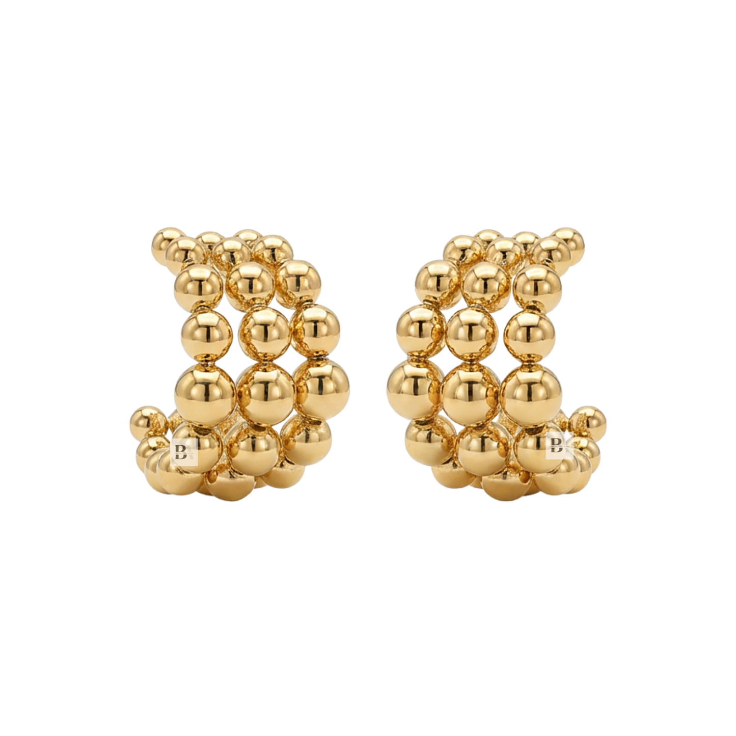 Pair of gold beaded earrings on a white background