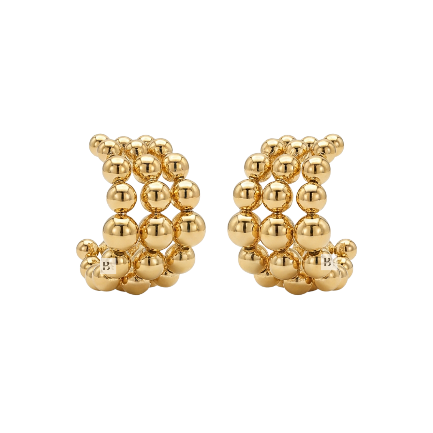 Pair of gold beaded earrings on a white background